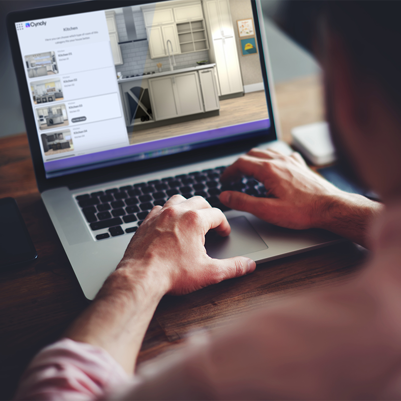 Cyncly software interface displayed on a laptop, with a user configuring a kitchen design project.