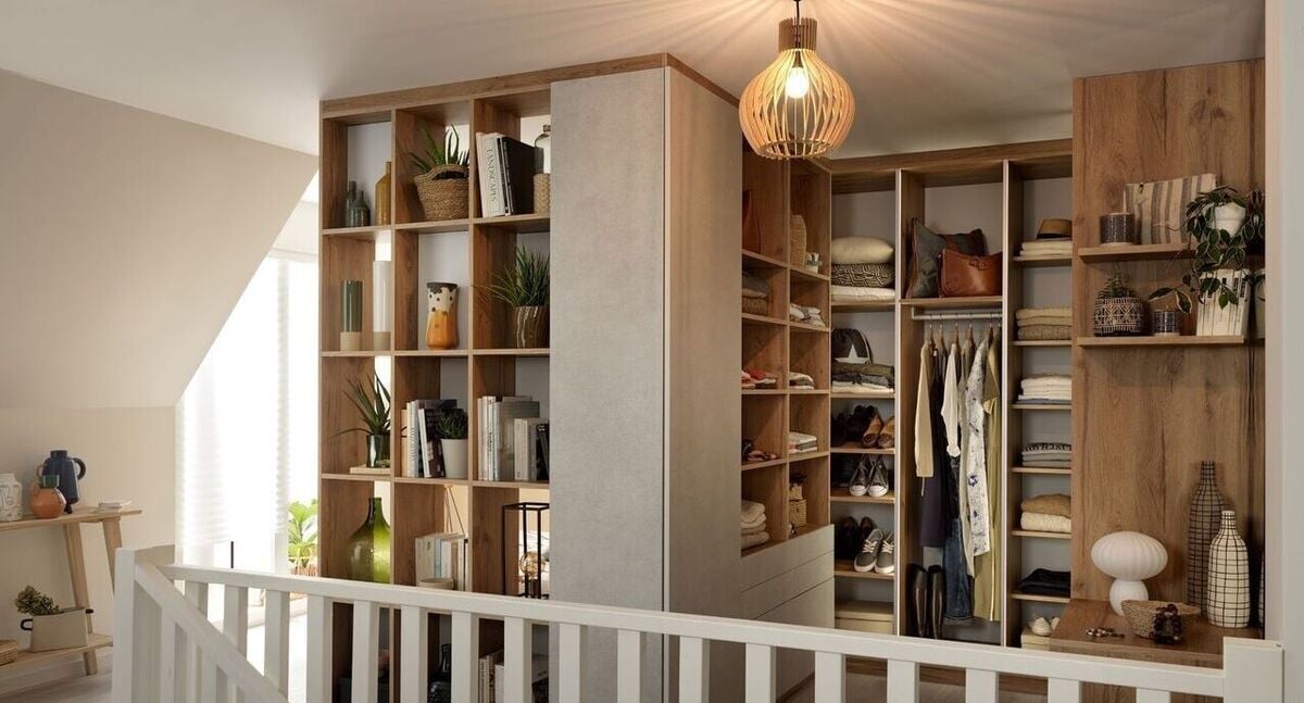 A well-arranged walk-in closet with shelves and a modern light fixture.