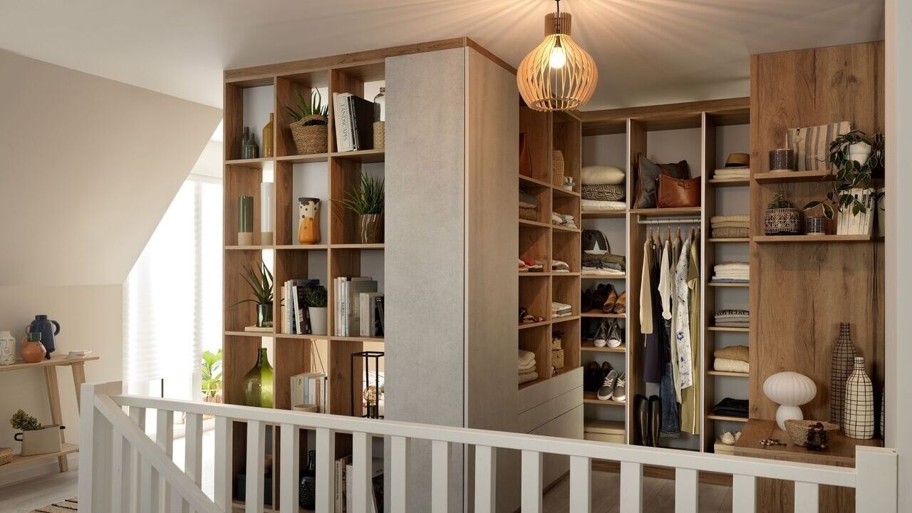 Spacious walk-in closet with multiple shelves for organized storage.