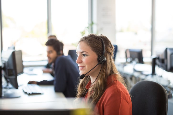 A woman wearing a headset