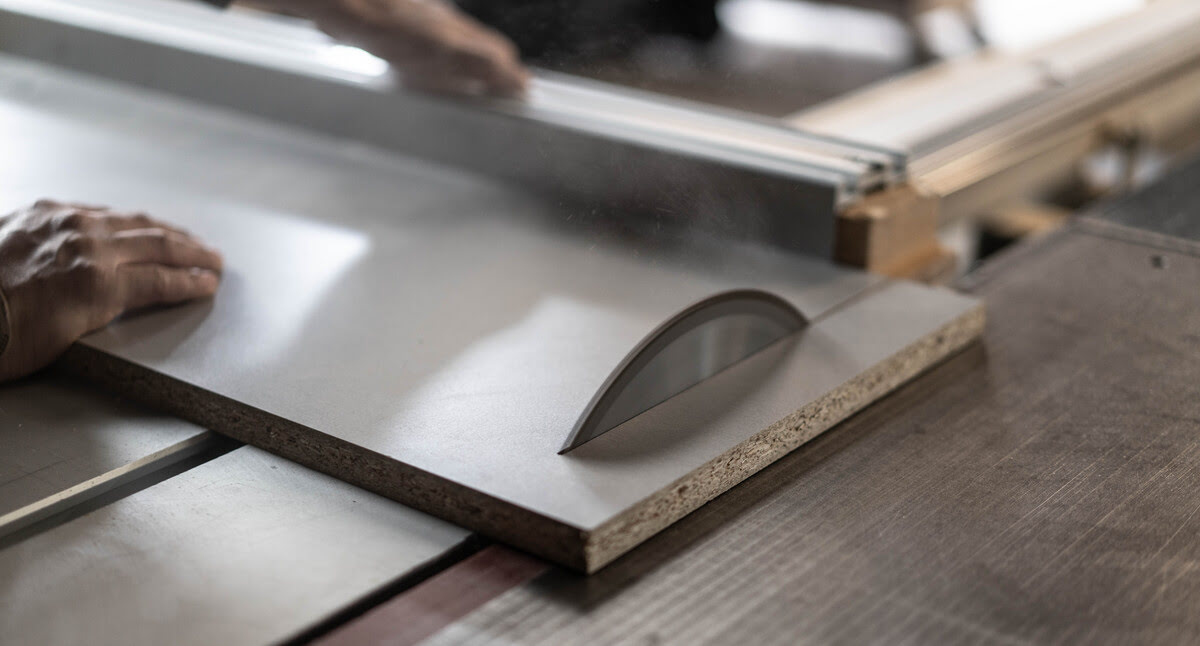 A person operates a table saw